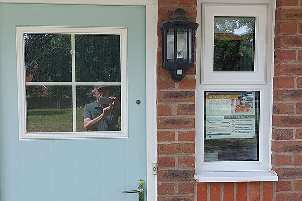 A Lib Dem leaflet displayed in a window