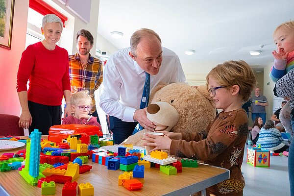 Ed Davey entertaining children at Stepping Stones charity