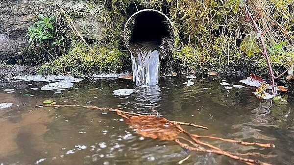 sewage discharging into a river